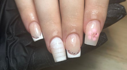 Stylish French manicure with glitter at Nails by Aisha, Pudsey, England, GB.