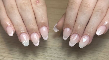 Elegant French nails with subtle heart at Nails by Aisha, Pudsey, England, GB.