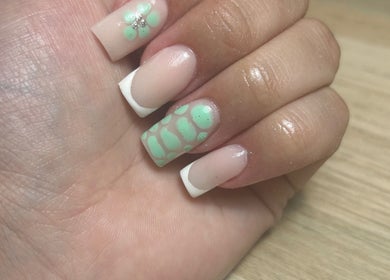Mint green floral nail art at Nails by Aisha, Pudsey, England, GB, showcasing delicate design.