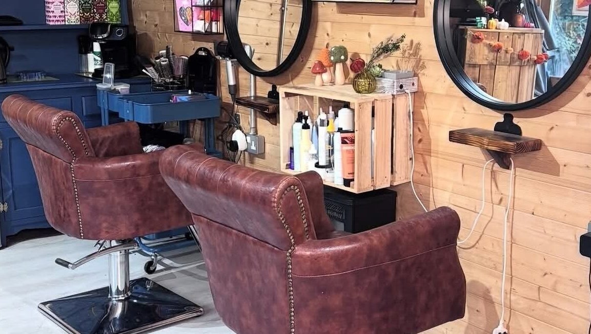 Elegant salon chairs and mirrors at Aimez Vous, Marks Tey, England, GB, creating a chic, cozy atmosphere.