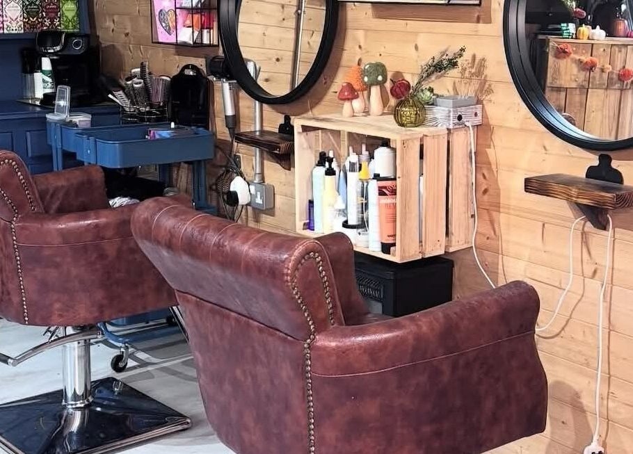 Elegant salon chairs and mirrors at Aimez Vous, Marks Tey, England, GB, creating a chic, cozy atmosphere.