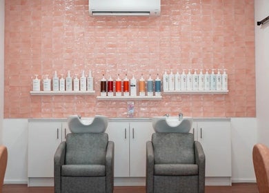Luxurious shampoo chairs at HairyAdelaide, Mona Vale, New South Wales, AU with chic tile backdrop.