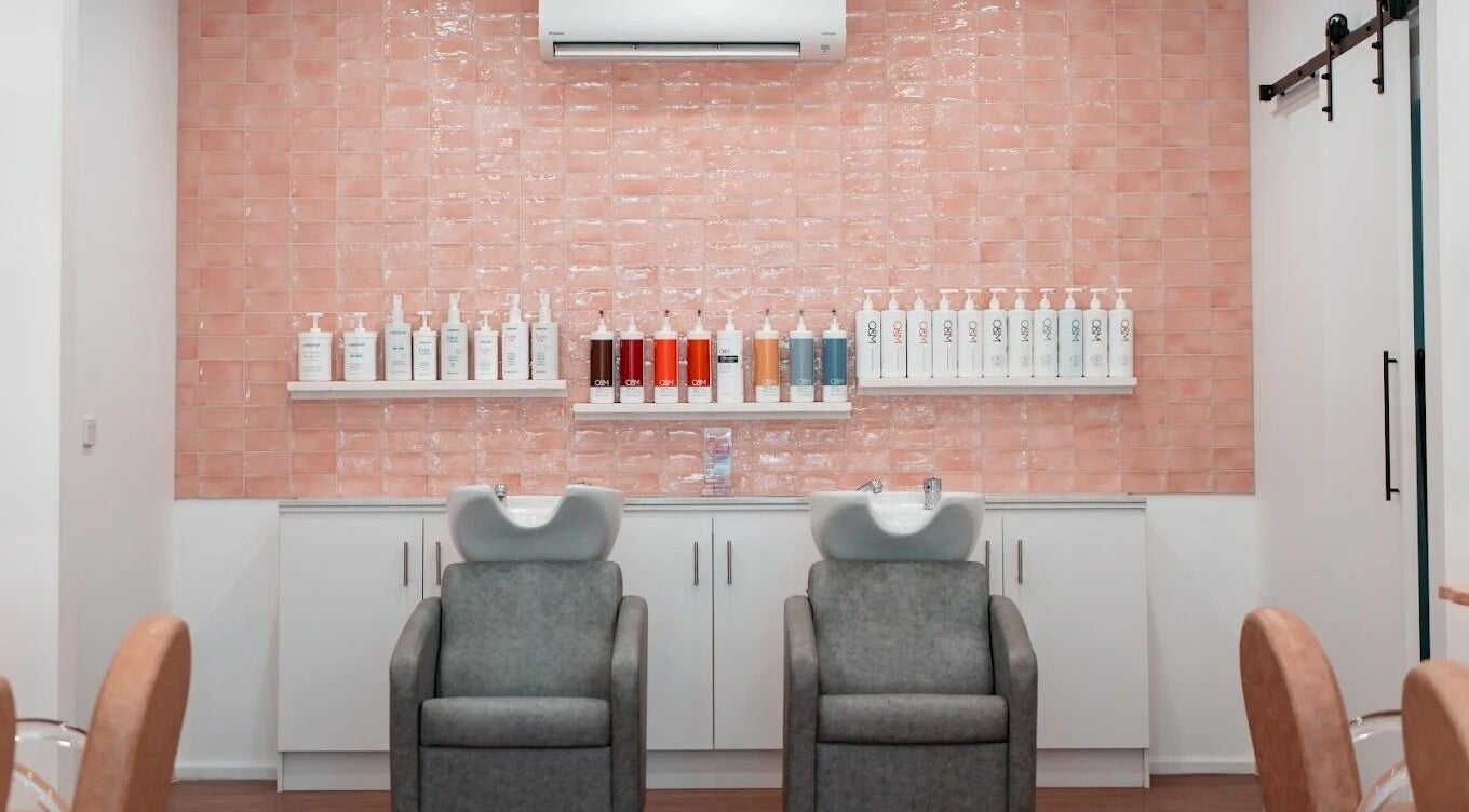 Luxurious shampoo chairs at HairyAdelaide, Mona Vale, New South Wales, AU with chic tile backdrop.