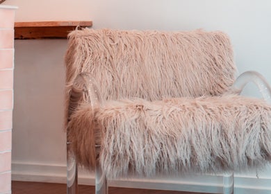 Chic fur-covered chair at HairyAdelaide, Mona Vale, New South Wales, AU. Perfect spot for relaxation and style.