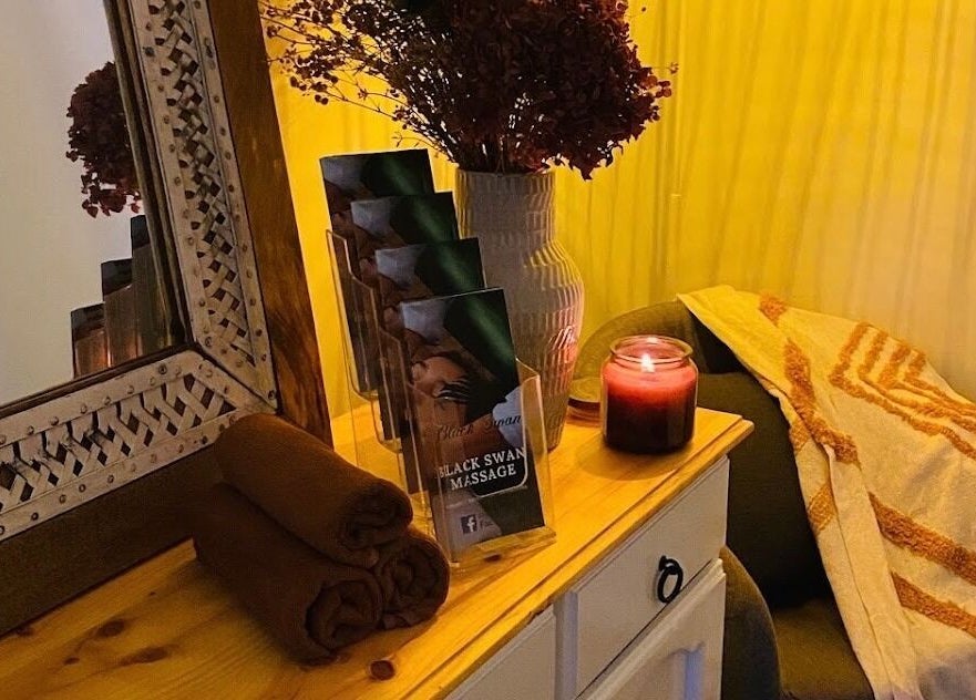 Cozy massage corner at Black Swan Asian Massage Devonport, featuring a candle and decor in Devonport, Tasmania, AU.