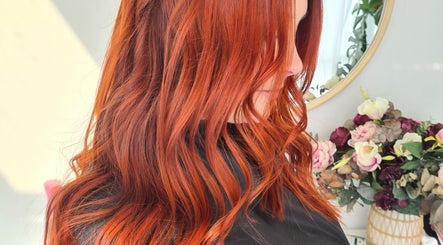 Woman with vibrant red hair styled in waves at HairbyMrsBlades, Porirua, Wellington Region, NZ.