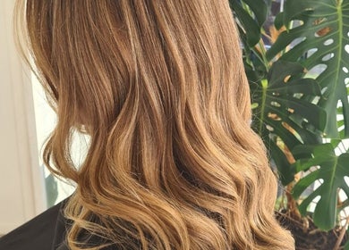 Elegant golden waves styled at HairbyMrsBlades, Porirua, Wellington Region, NZ. Natural beauty enhancement.