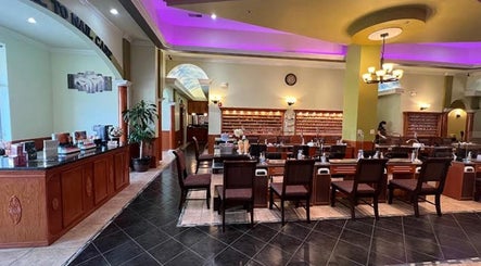 Chic and welcoming interior of Athena nail spa in Naperville, Illinois, US showcasing manicure stations.