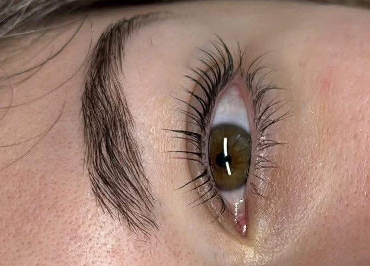 Close-up of expertly shaped eyebrow and long lashes at Nita Beauty, Melbourne, Victoria, AU.