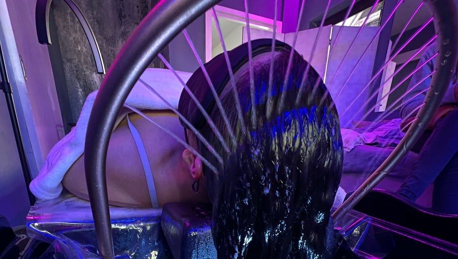 A relaxing hydrotherapy treatment at CC Euphoria, Cape Town, ZA with water gently cascading on a client's head.