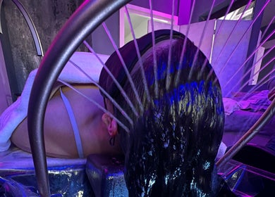 A relaxing hydrotherapy treatment at CC Euphoria, Cape Town, ZA with water gently cascading on a client's head.