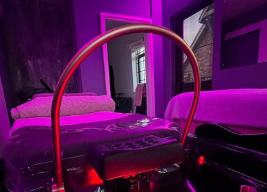 Elegant spa room at CC Euphoria in Cape Town, ZA, featuring a cozy massage table in ambient lighting.