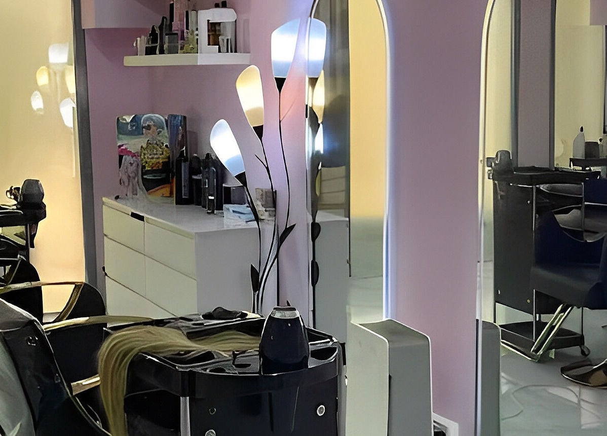 Modern salon interior at Hello Dolly Beauty Center, Doha, Doha Municipality, QA with stylish decor and lighting.
