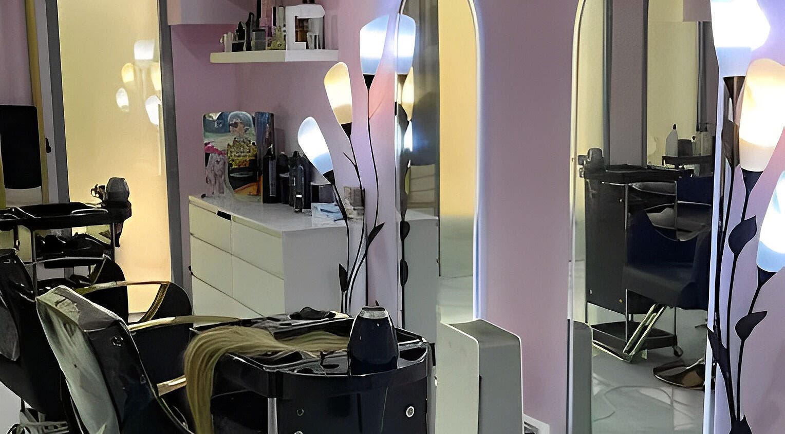 Modern salon interior at Hello Dolly Beauty Center, Doha, Doha Municipality, QA with stylish decor and lighting.