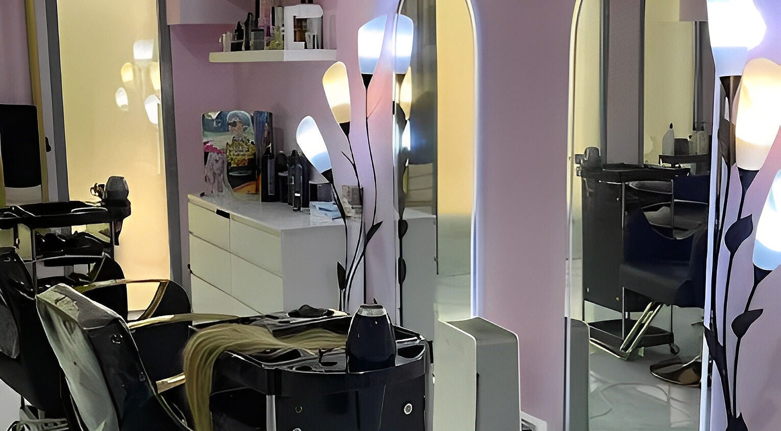 Modern salon interior at Hello Dolly Beauty Center, Doha, Doha Municipality, QA with stylish decor and lighting.
