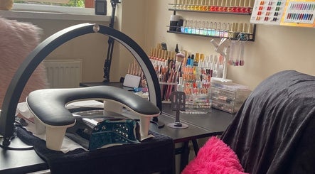Nailxtation's stylish nail station in Salford, England, GB, showcasing tools and vibrant polish displays.