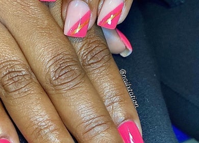 Elegant pink manicure with gold accents at Nailxtation, Salford, England, GB, showcasing expert nail design.