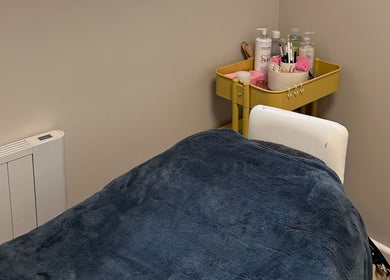 Comfortable treatment space at Defined Aesthetics & Beauty in Gamlingay, England, GB with essential products.