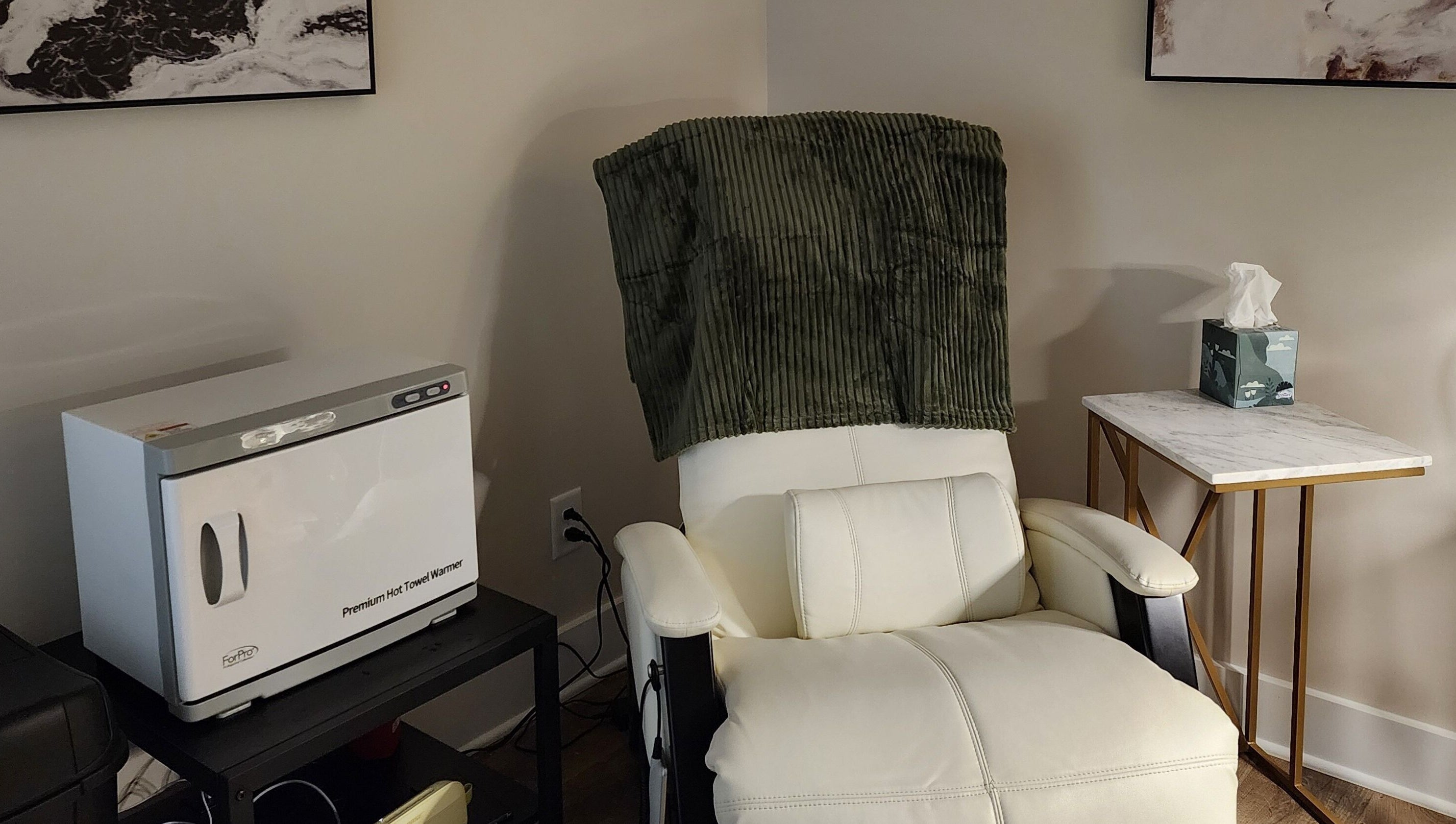 Relaxing chair and towel warmer at Golden Kate Nails, Clarksville, Tennessee, US, enhancing comfort and luxury.
