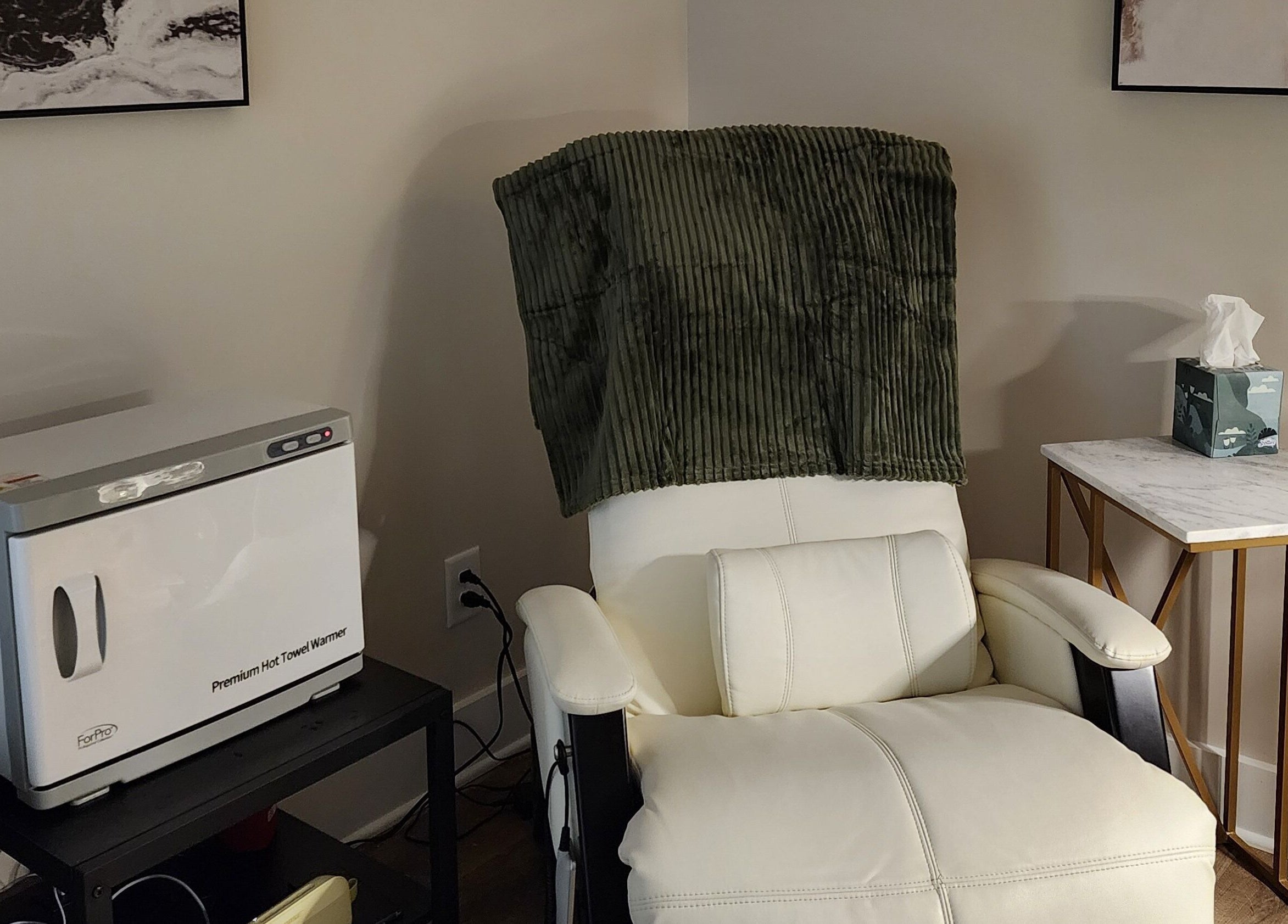 Relaxing chair and towel warmer at Golden Kate Nails, Clarksville, Tennessee, US, enhancing comfort and luxury.