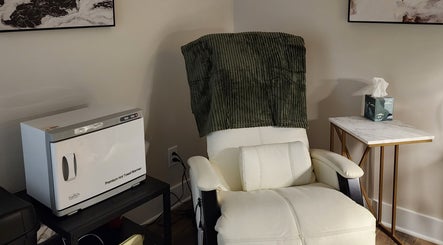 Relaxing chair and towel warmer at Golden Kate Nails, Clarksville, Tennessee, US, enhancing comfort and luxury.