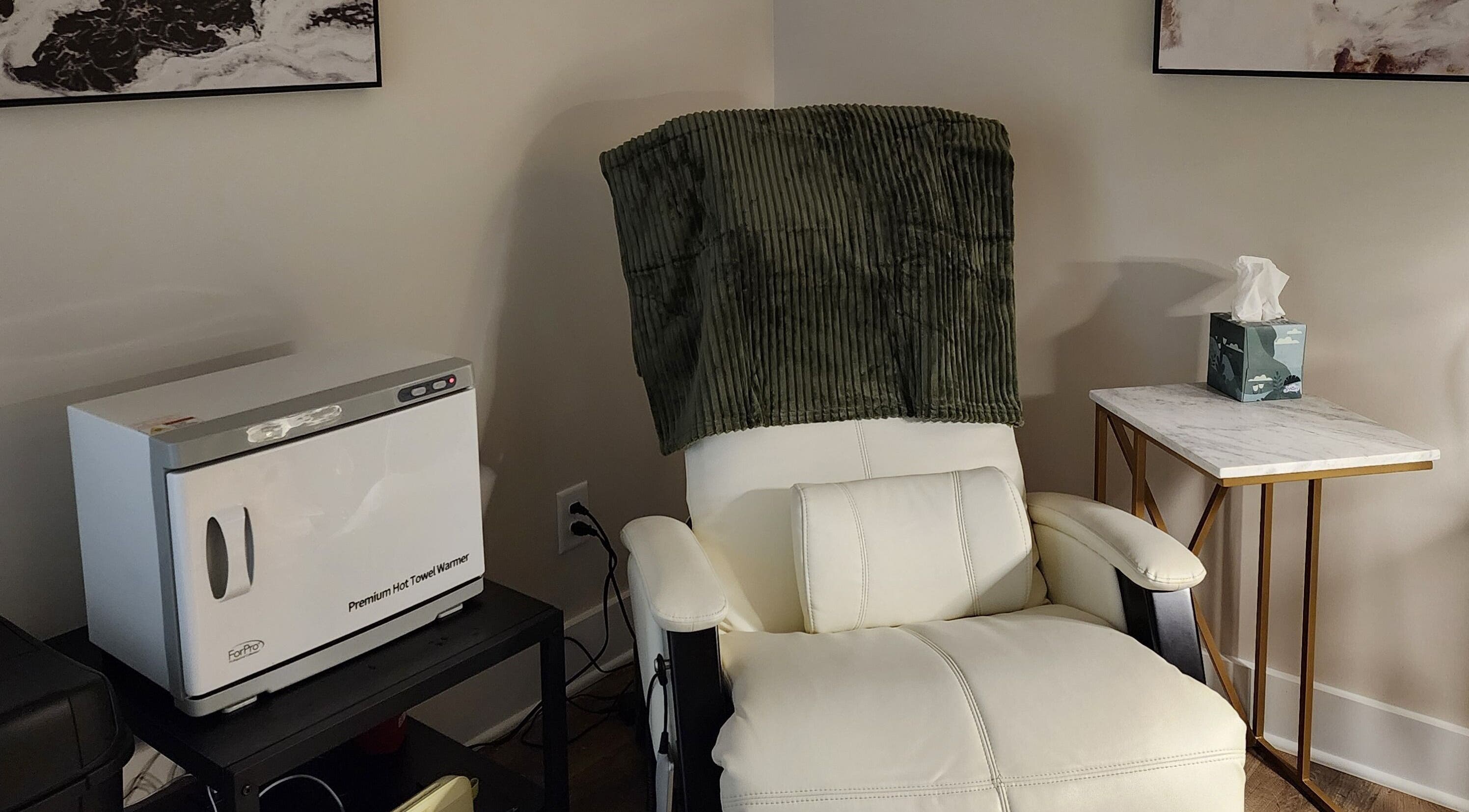 Relaxing chair and towel warmer at Golden Kate Nails, Clarksville, Tennessee, US, enhancing comfort and luxury.
