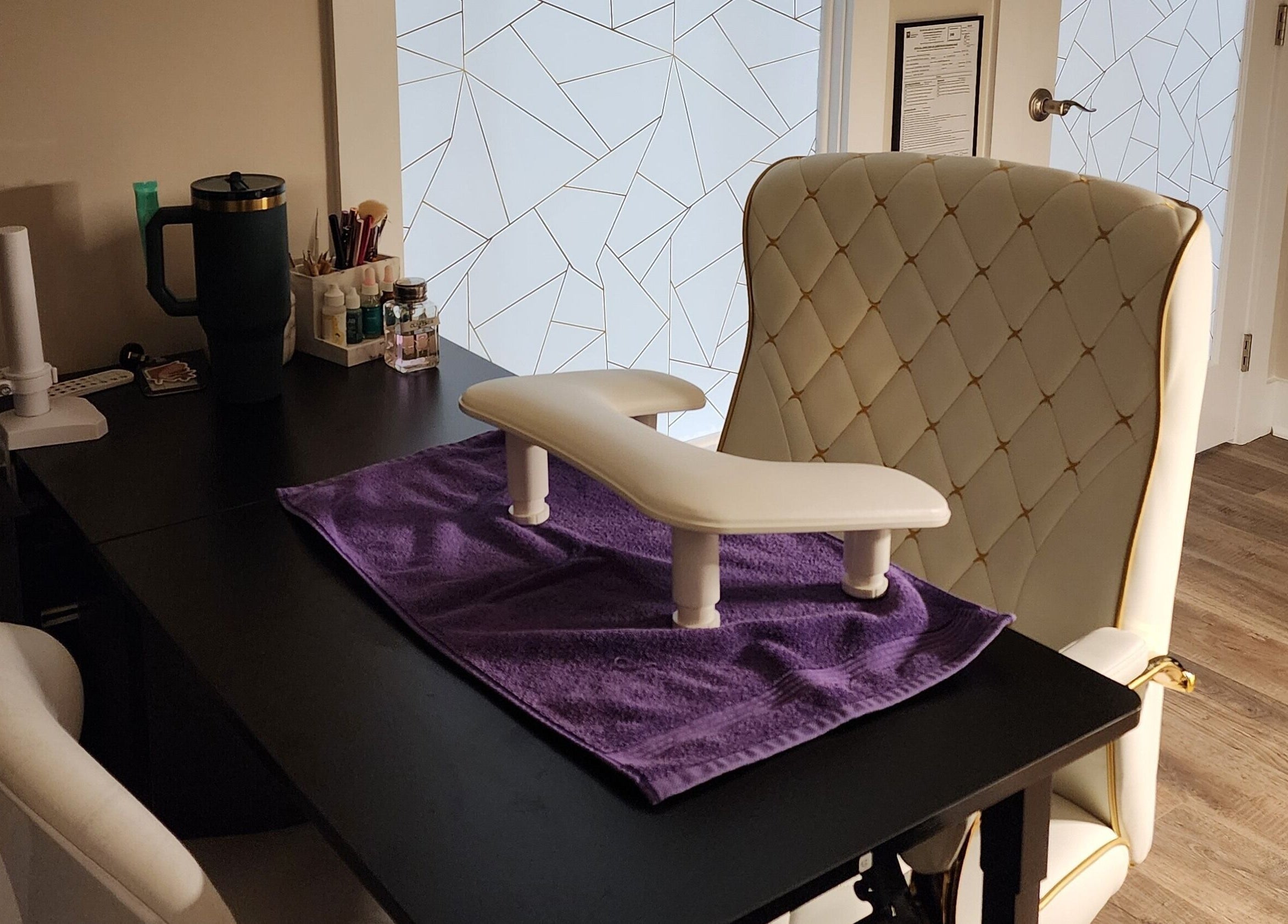 Luxurious nail station at Golden Kate Nails in Clarksville, Tennessee, US, featuring plush seating and tools.