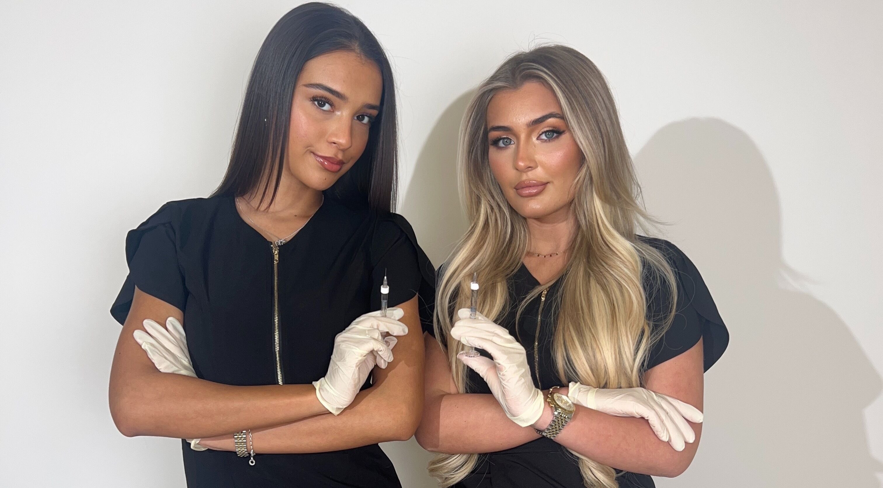 Beauty experts at XOXO Studios, West Wickham, England, GB, holding fine equipment with care.