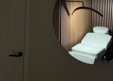 Elegant treatment room at Aura Beauty in Aberdeen, Scotland, GB showcasing modern design and comfort.