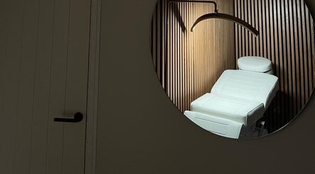 Elegant treatment room at Aura Beauty in Aberdeen, Scotland, GB showcasing modern design and comfort.