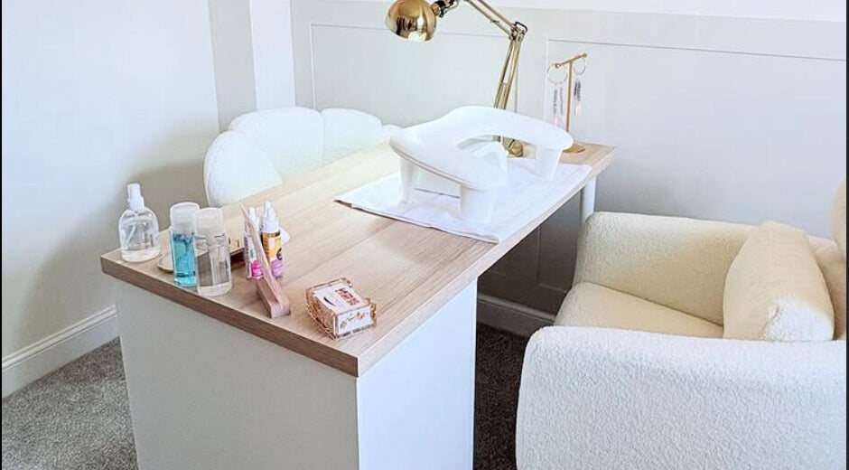 Bright nail salon area at Studio Lune Beauty, Shrewsbury, England, GB with a cozy chair and nail products.