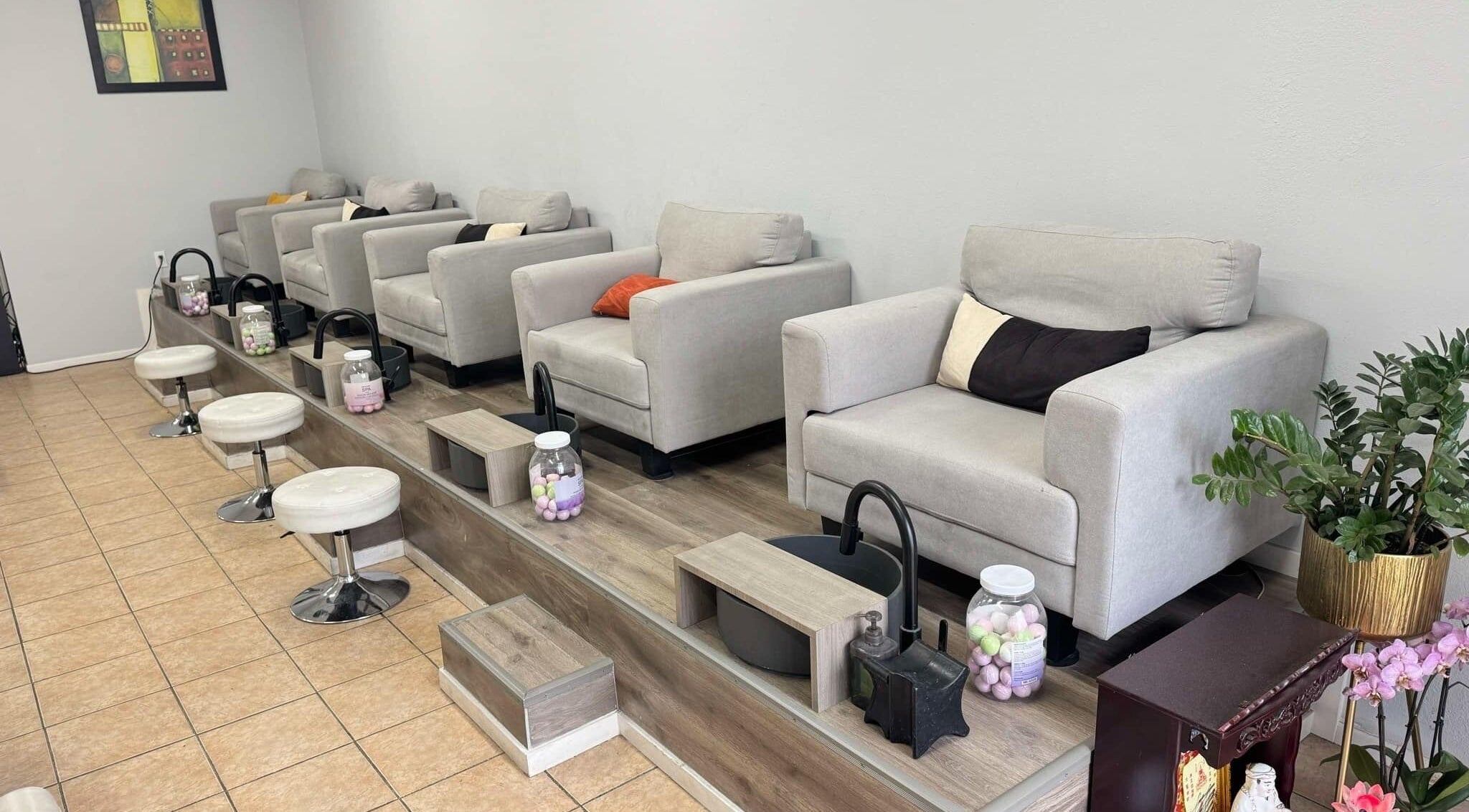 Luxurious pedicure stations at Shiny Nails in Pasadena, California, US, featuring plush seating and elegant decor.