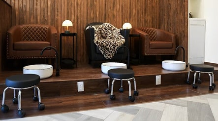 Luxurious pedicure stations at Tala Beauty in Toronto, Ontario, CA, featuring plush seating and sleek foot basins.