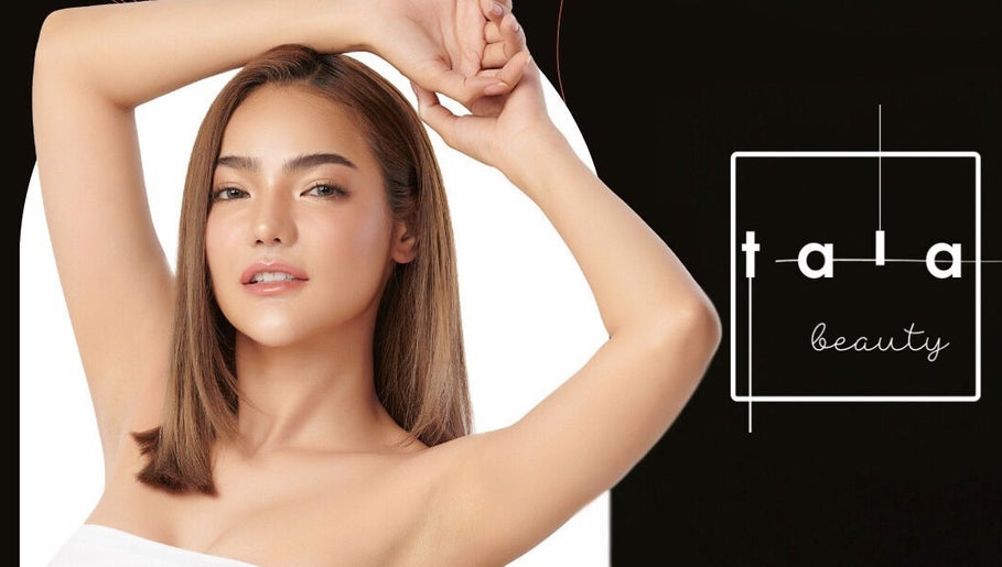 A model showcasing beauty at Tala Beauty Bar, Toronto, Ontario, CA with a sleek hairstyle and glowing skin.