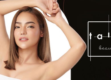 A model showcasing beauty at Tala Beauty Bar, Toronto, Ontario, CA with a sleek hairstyle and glowing skin.