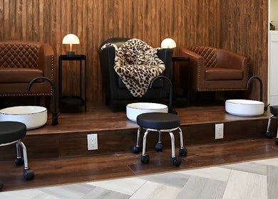 Elegant pedicure setup at Tala Beauty Bar, Toronto, Ontario, CA, featuring plush seating and stylish decor.