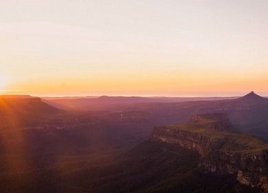 Breathtaking sunset view from South Coast Presence in Woodstock, New South Wales, AU over rolling hills.