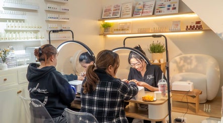 Visitors enjoying nail services at Kim Studio, Thành Phố Đà Lạt, Lâm Đồng, VN. Relaxing beauty experience.