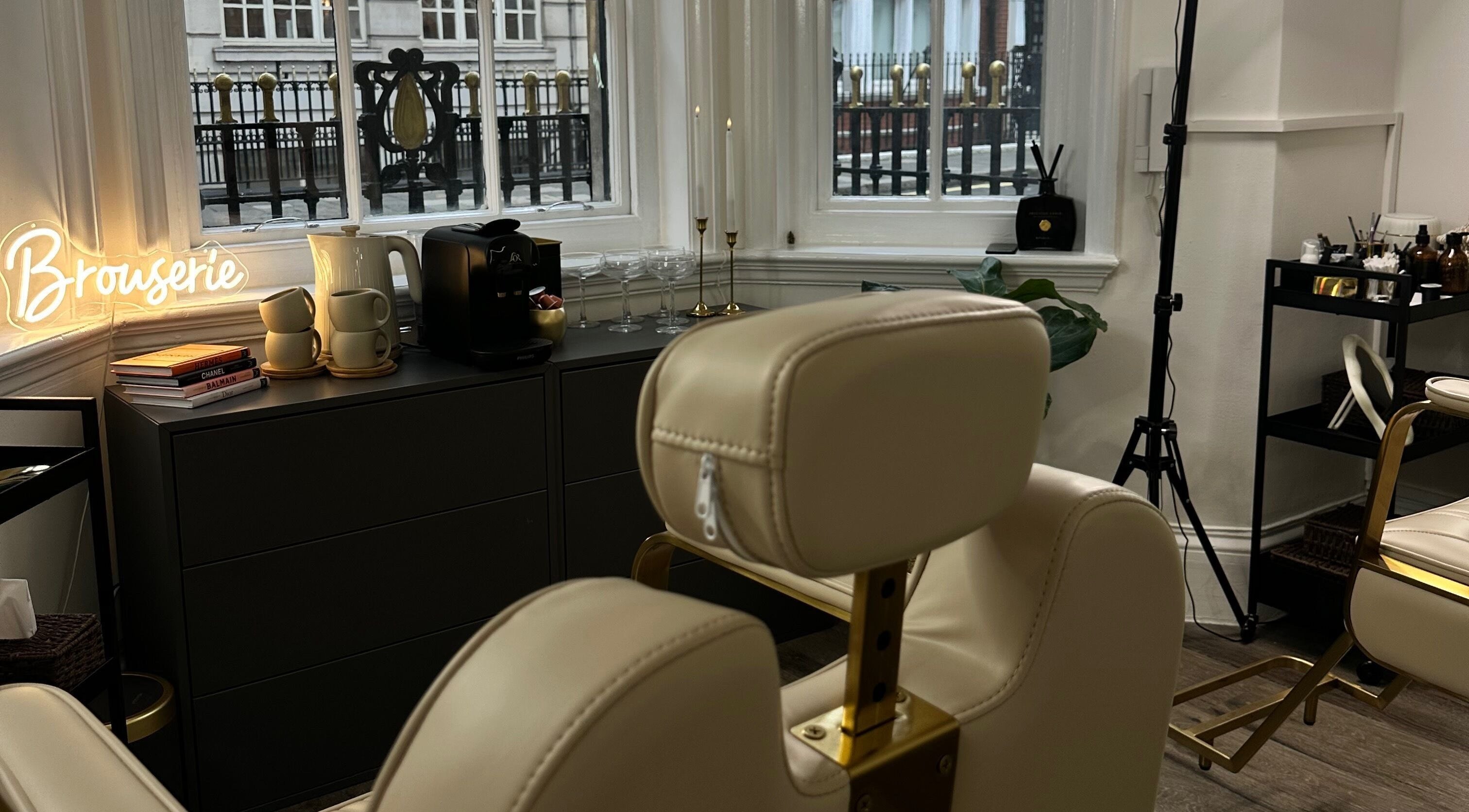 Elegant interior of Browserie London with cream chairs and decor in London, England, GB.
