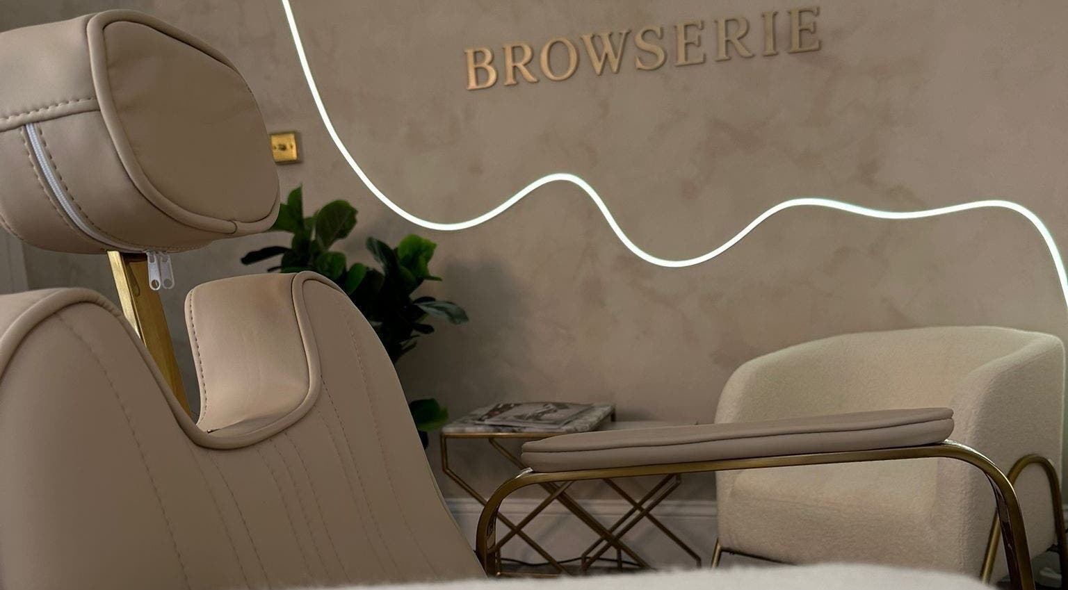 Elegant therapy room at Browserie London, featuring plush seating and modern decor, located in London, England, GB.