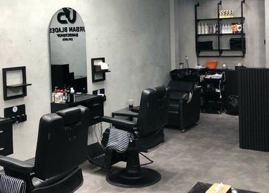 Modern interior of Urban Blades Barbershop in Bali, Bali, ID showcasing stylish chairs and decor.