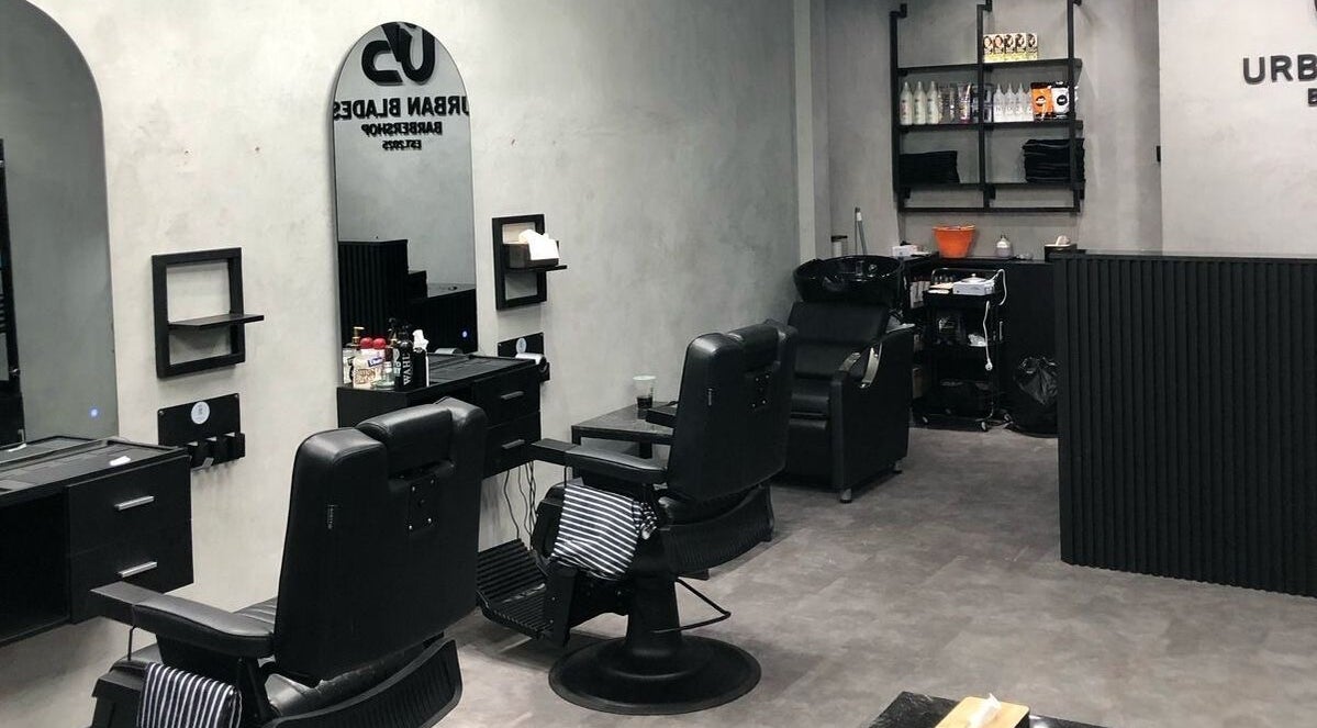 Modern interior of Urban Blades Barbershop in Bali, Bali, ID showcasing stylish chairs and decor.