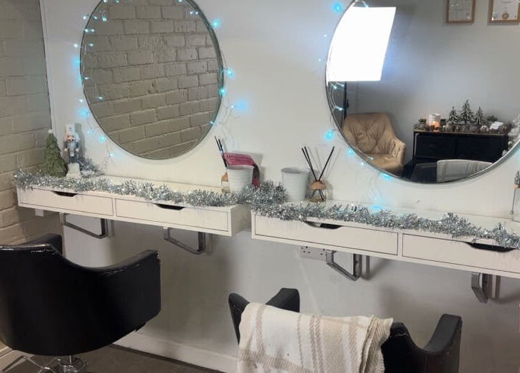 Elegant beauty station at Extensions by Rebecca, Wythenshawe, England, GB, with festive decor and ambient lighting.