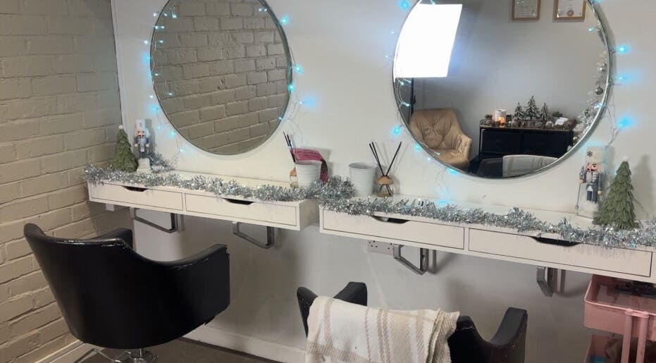 Elegant beauty station at Extensions by Rebecca, Wythenshawe, England, GB, with festive decor and ambient lighting.