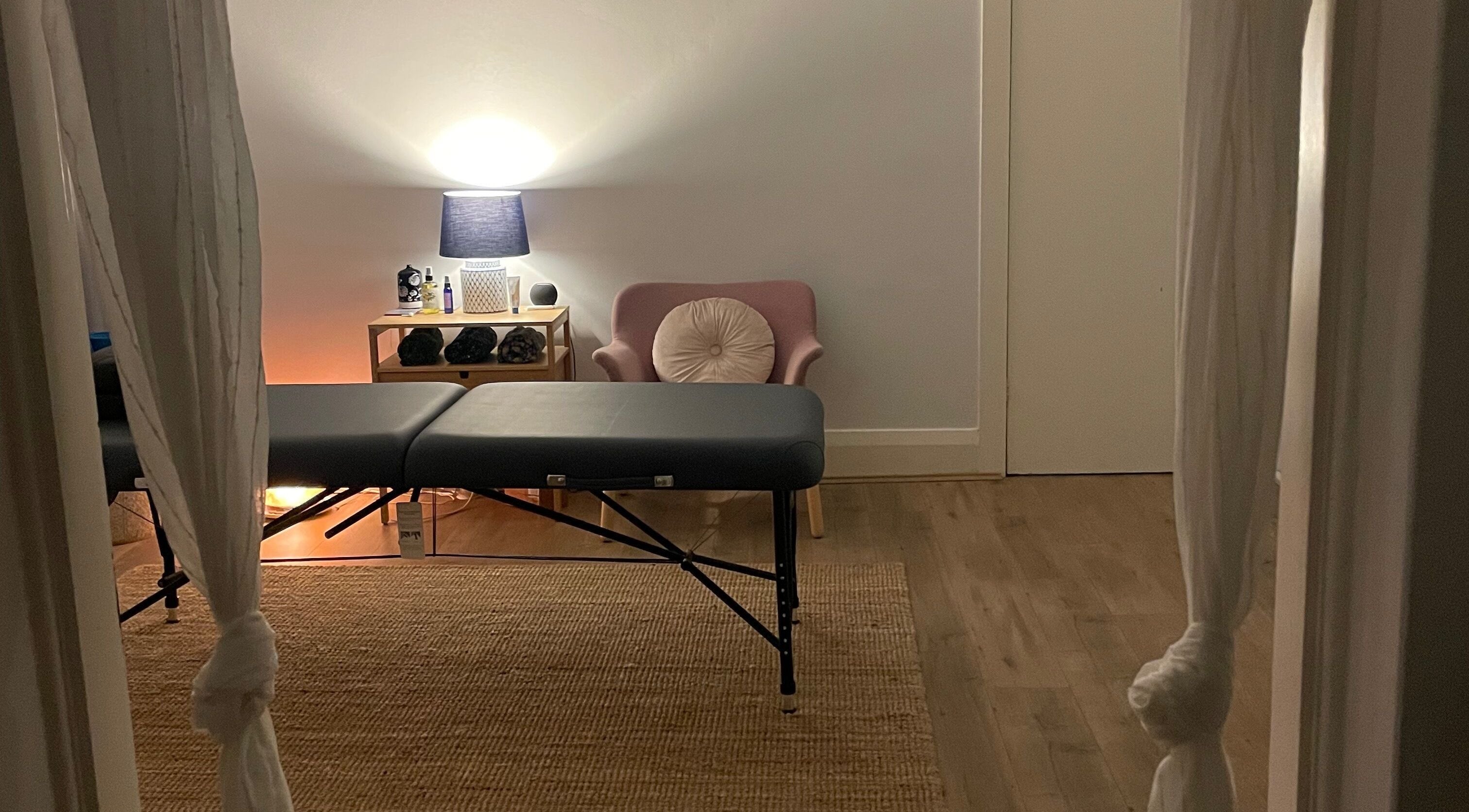 Massage room at Blaise Bowling Massage, Bellevue Hill, New South Wales, AU, featuring a comfortable table and cozy chair.