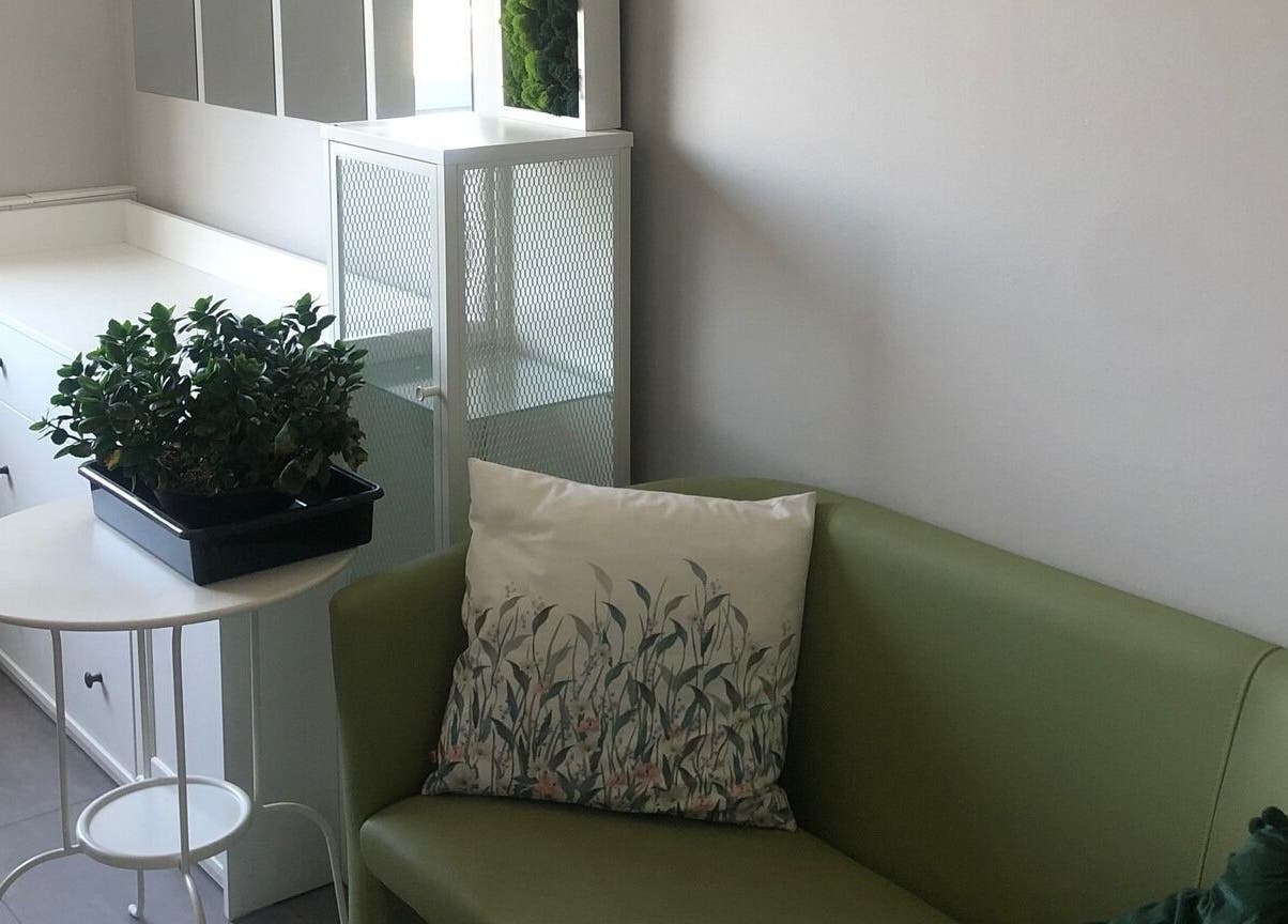Relax in the cozy corner seating with green sofa at Stuudio Bond, Tallinn, Harju maakond, EE.