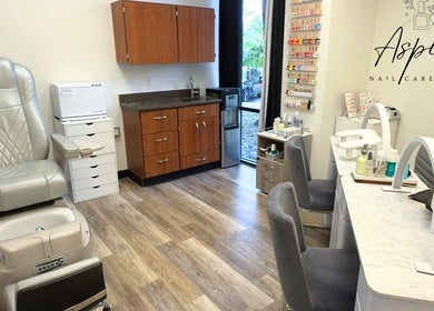 Modern Aspire Nail Care Studio in Greenwood Village, Colorado, US, showcasing elegant nail stations and pedicure chair.
