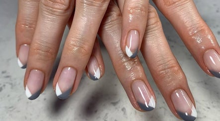 Elegant nail art with grey and white accents at Aspire Nail Care Studio, Greenwood Village, Colorado, US.