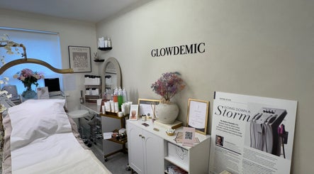 Tranquil treatment room at Glowdemic, Swindon, England, GB, featuring a cozy bed and skincare products.