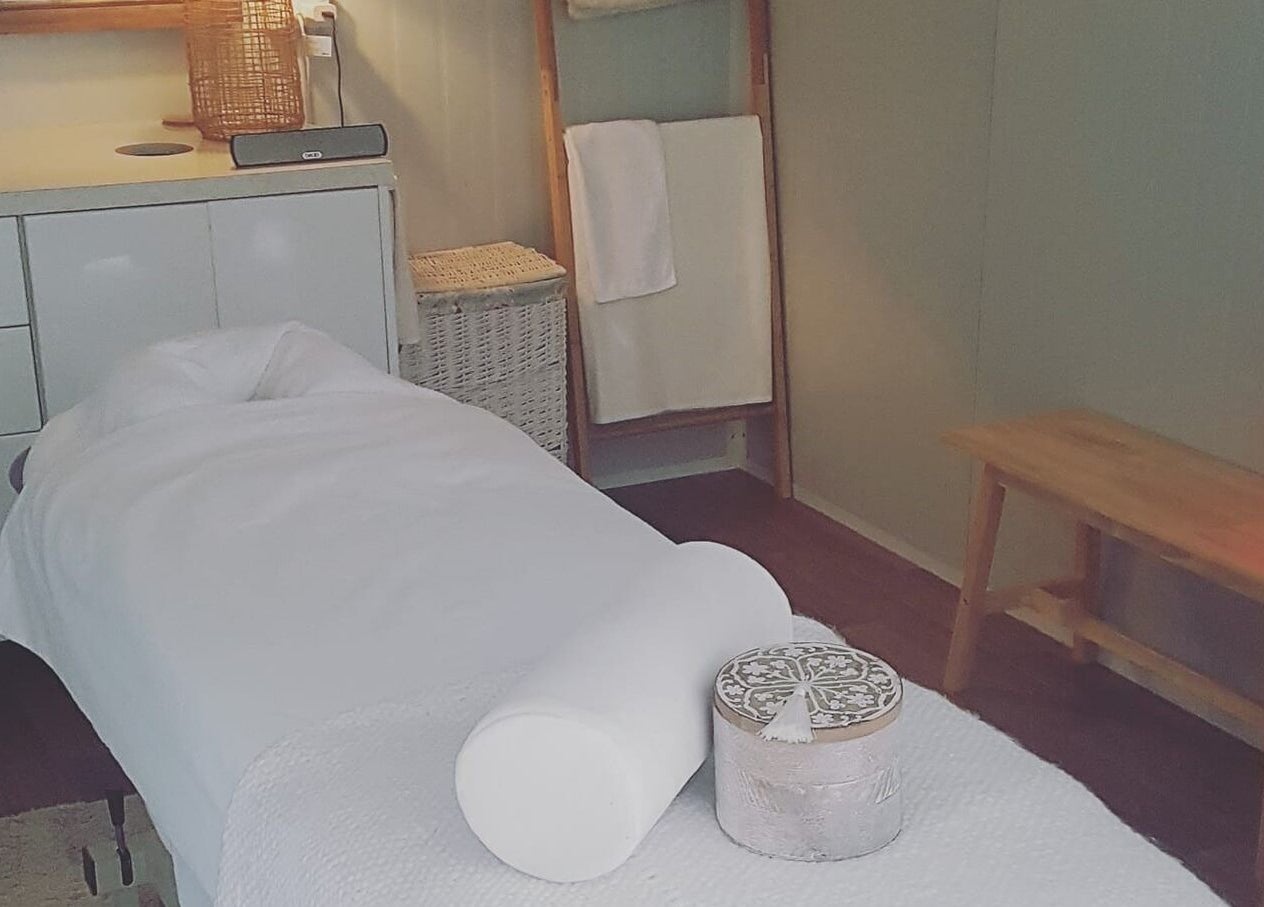 Tranquil massage room at My Little Oasis, Palmerston North, Manawatū-whanganui, NZ with cozy lighting and decor.